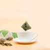 tea bag above a cup of Osmanthus Oolong Tea